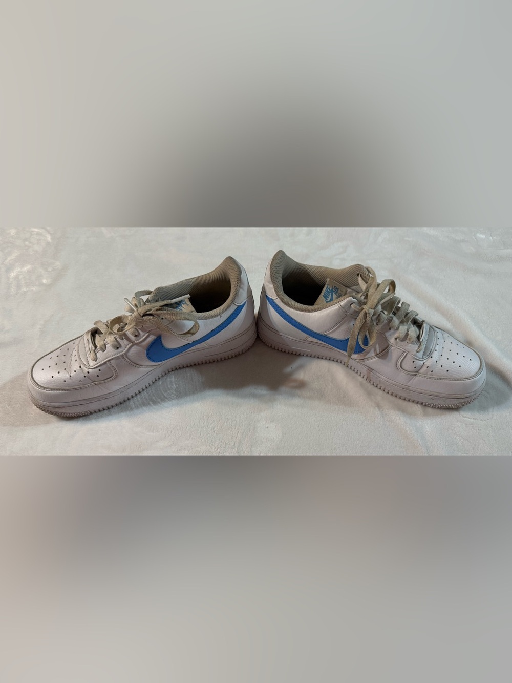 Nike White Low-Top Sneakers with Light Blue Swoosh
